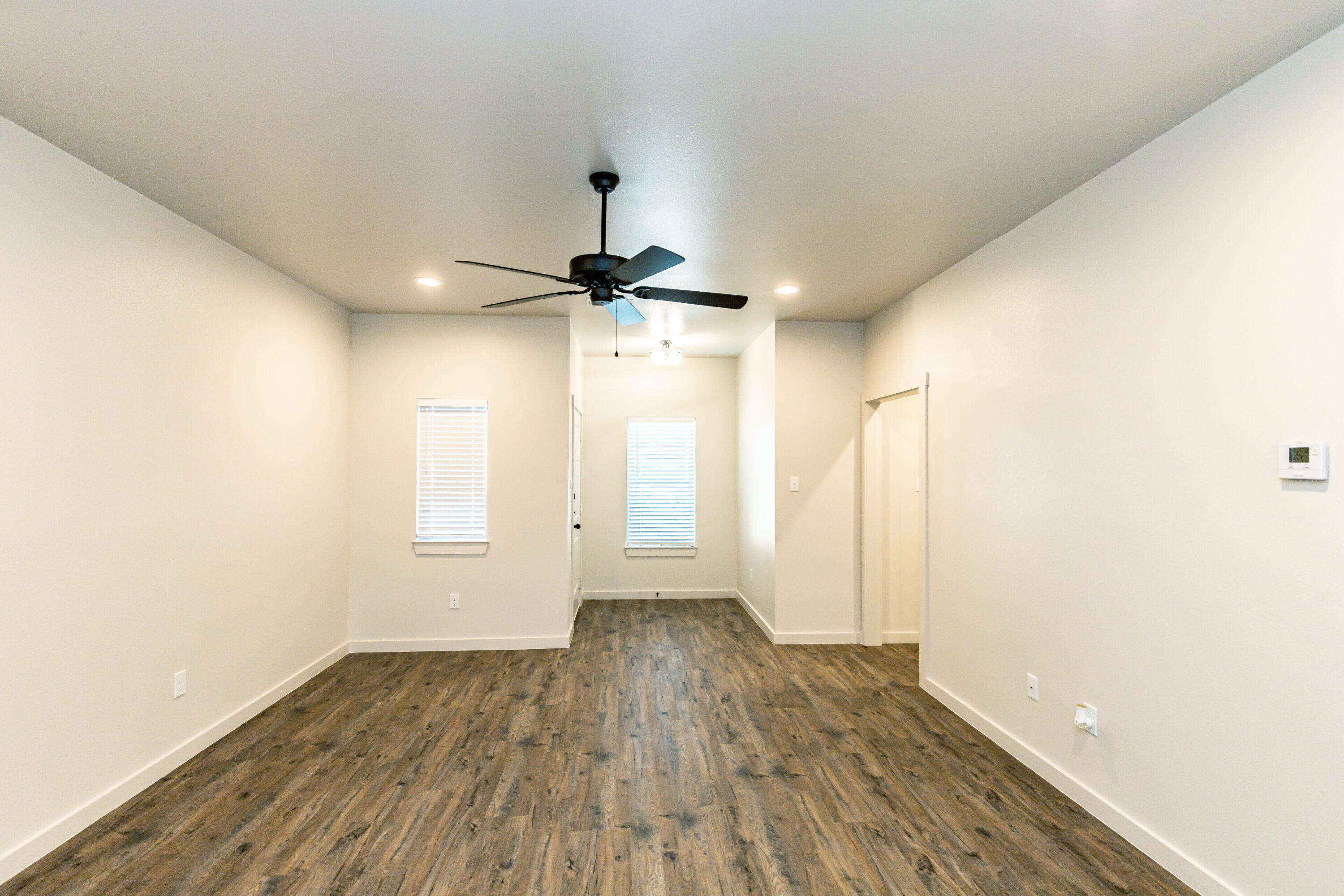 2526 138th Street Lubbock, TX 79423 - Photo 11 of 36 wooden floor in an empty room