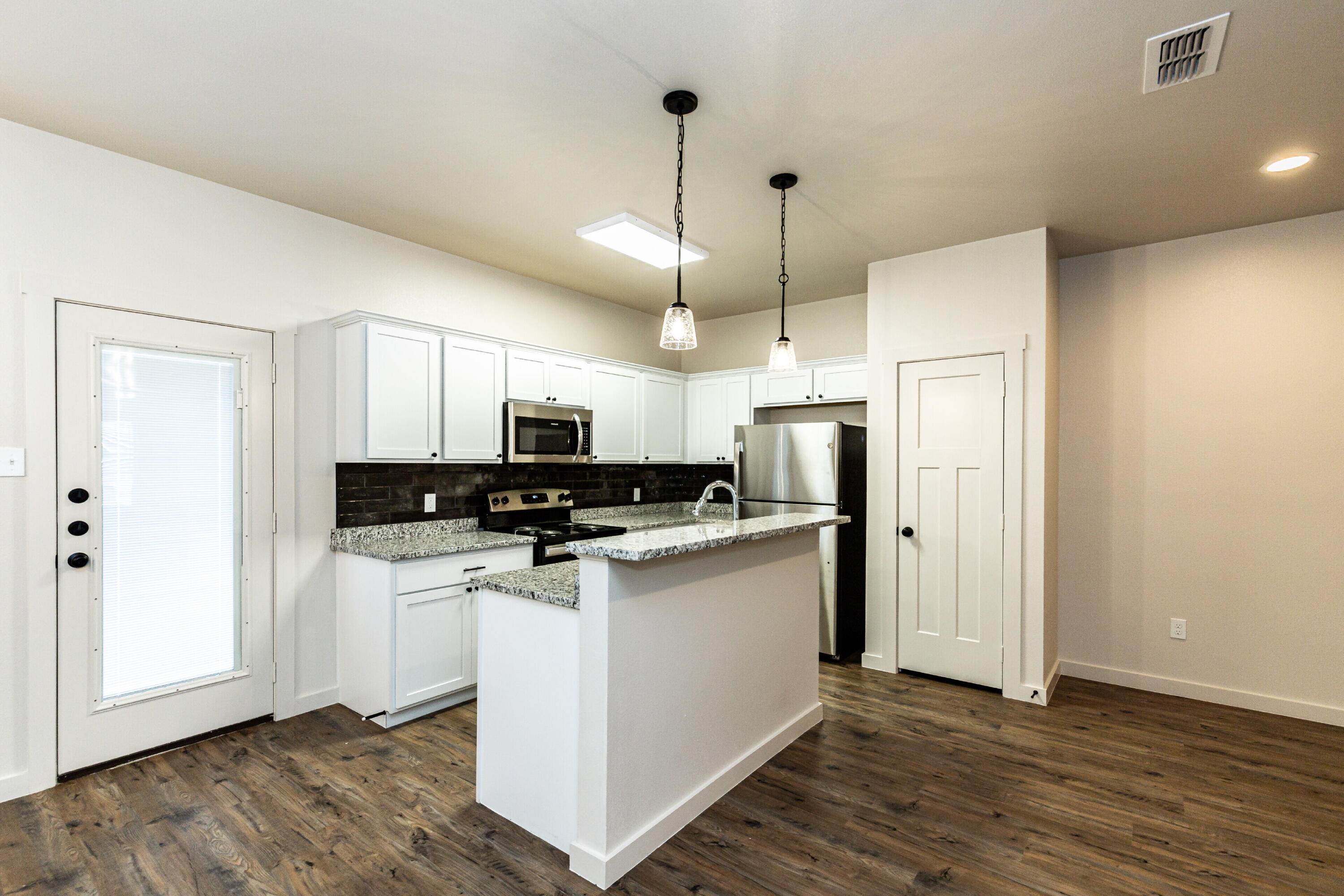 2526 138th Street Lubbock, TX 79423 - Photo 13 of 36 a kitchen with stainless steel appliances a refrigerator a stove a sink dishwasher and a refrigerator