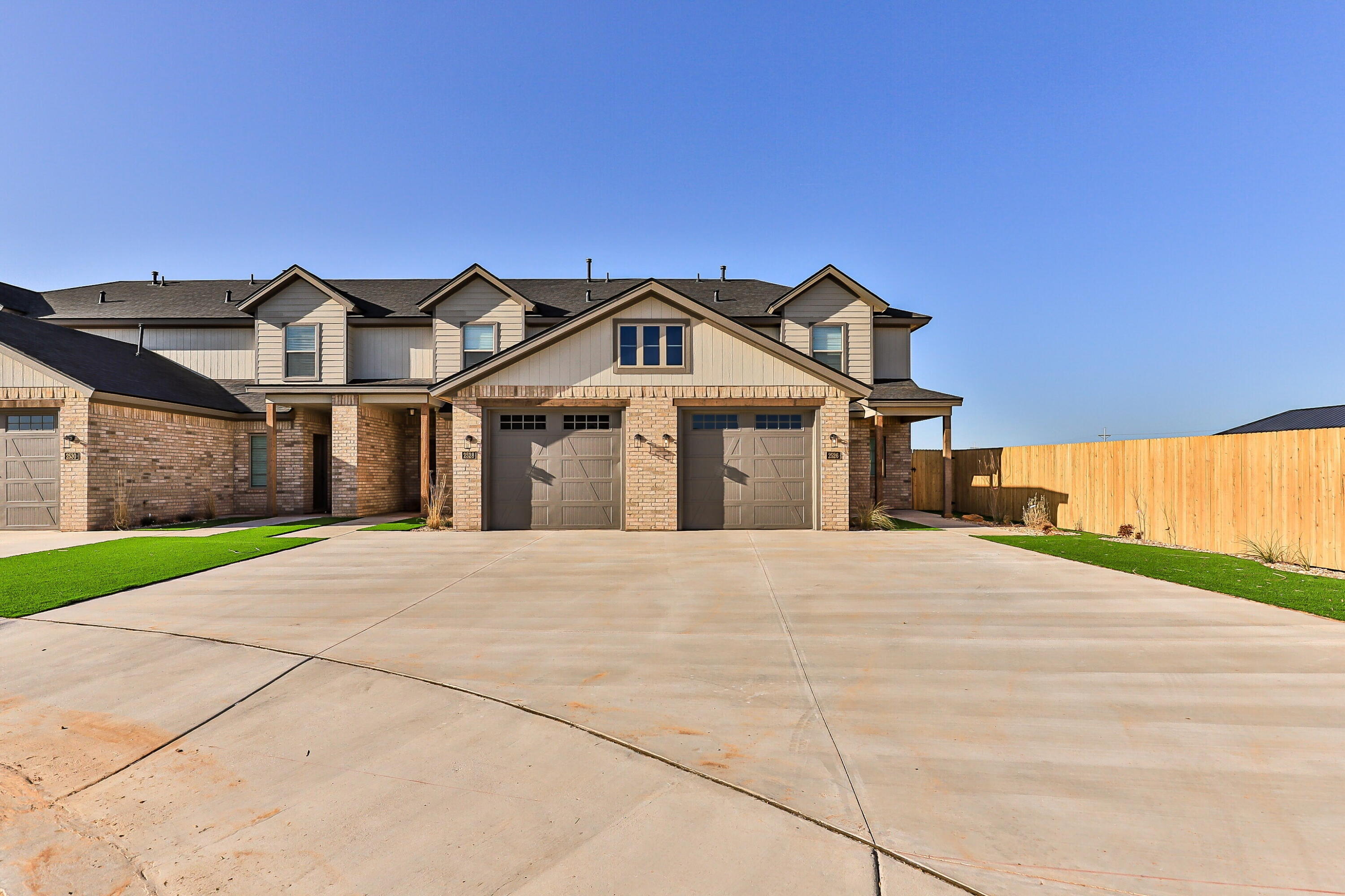 2526 138th Street Lubbock, TX 79423 - Photo 2 of 36 a front view of a house with a garden