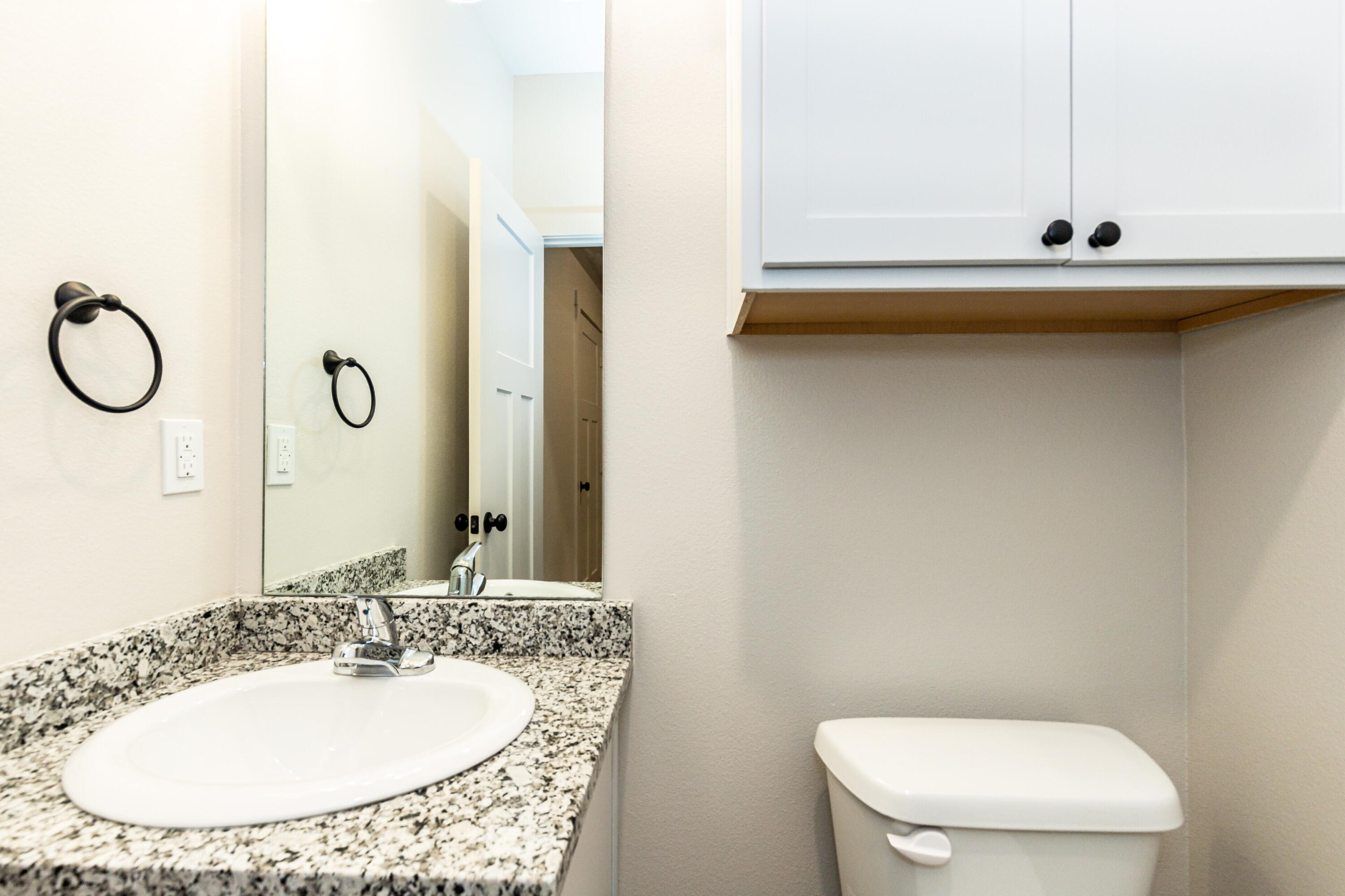 2526 138th Street Lubbock, TX 79423 - Photo 23 of 36 a bathroom with a sink and a mirror