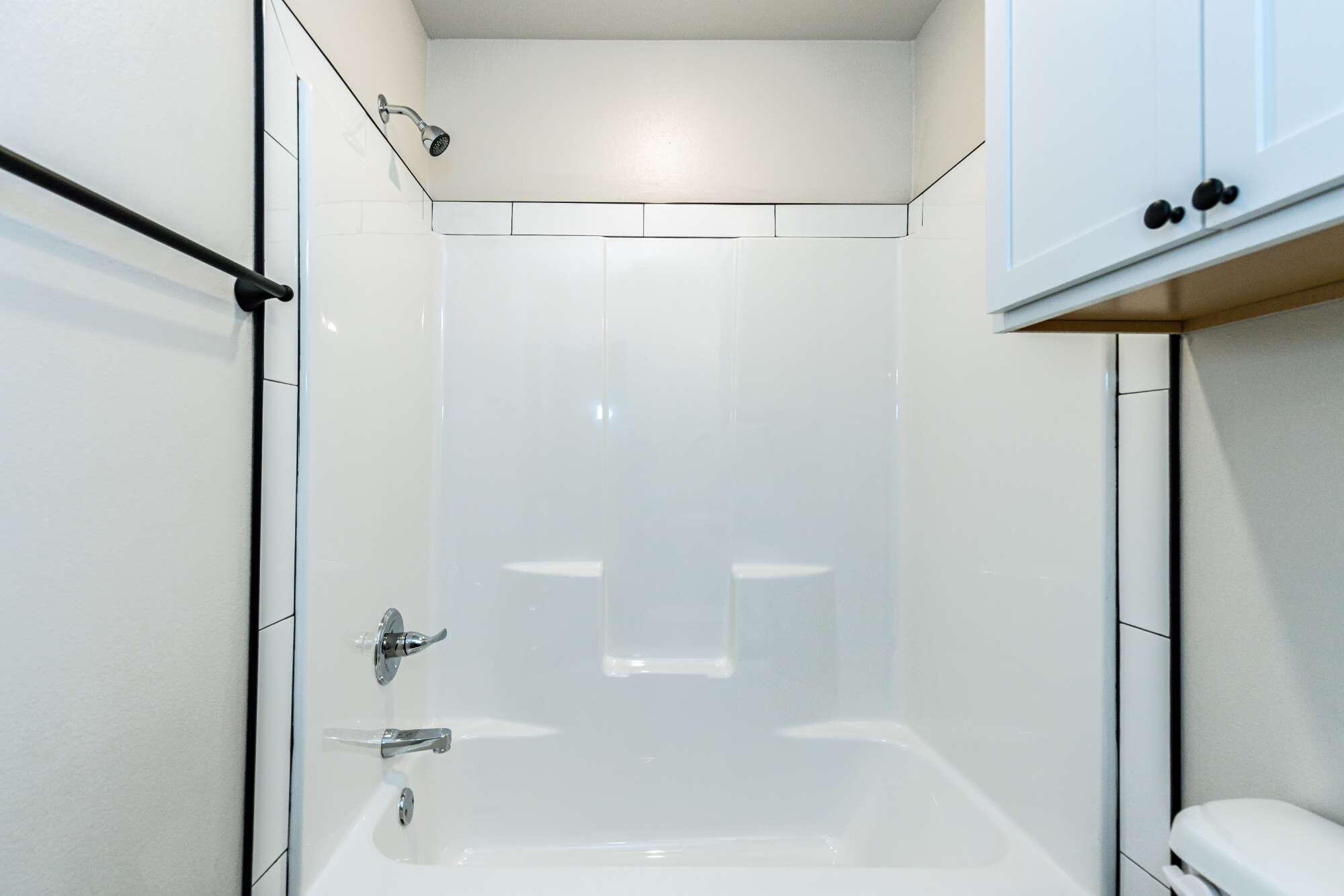 2526 138th Street Lubbock, TX 79423 - Photo 32 of 36 a bathroom with a shower and a bath tub