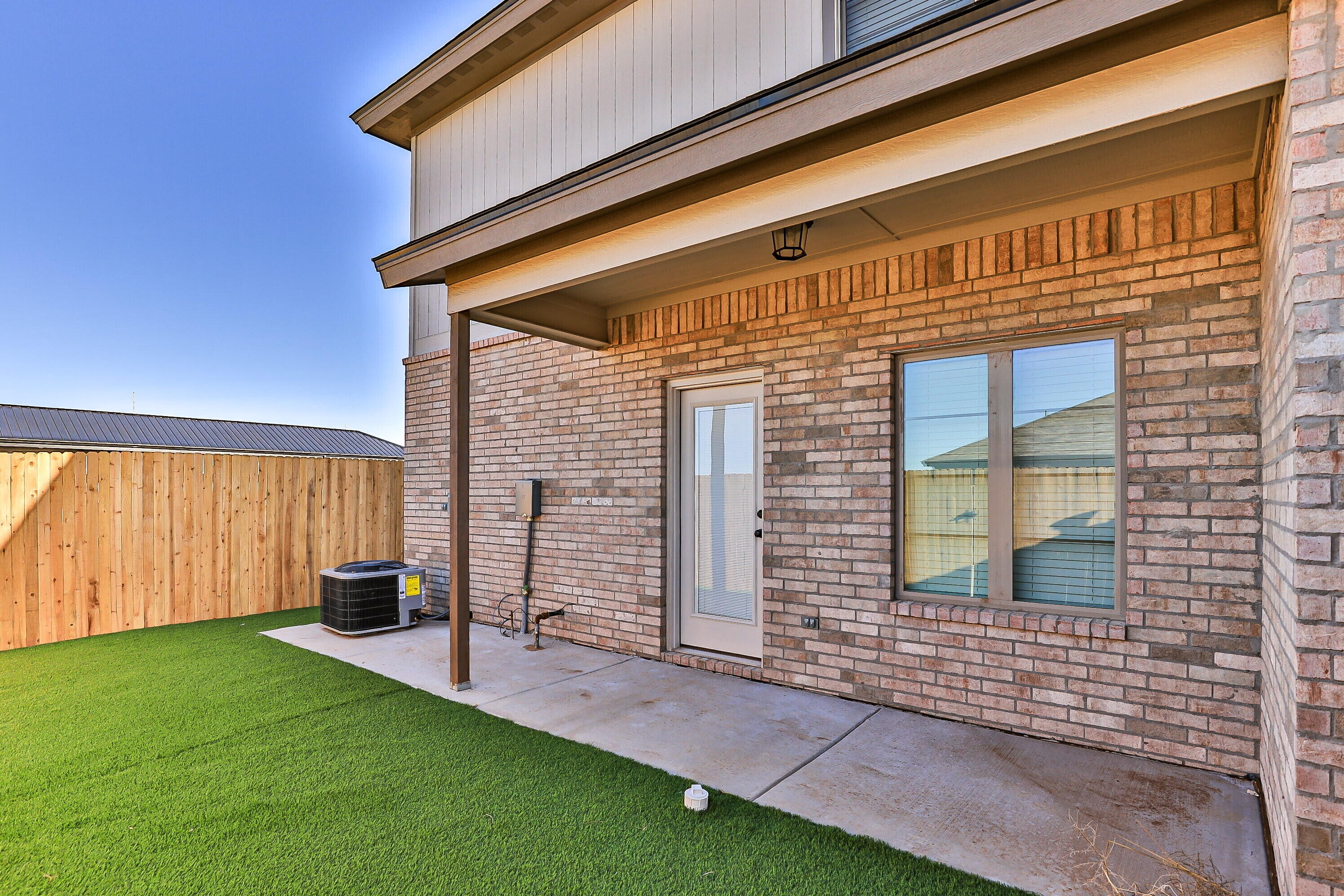 2526 138th Street Lubbock, TX 79423 - Photo 34 of 36 a front view of a house with a garden