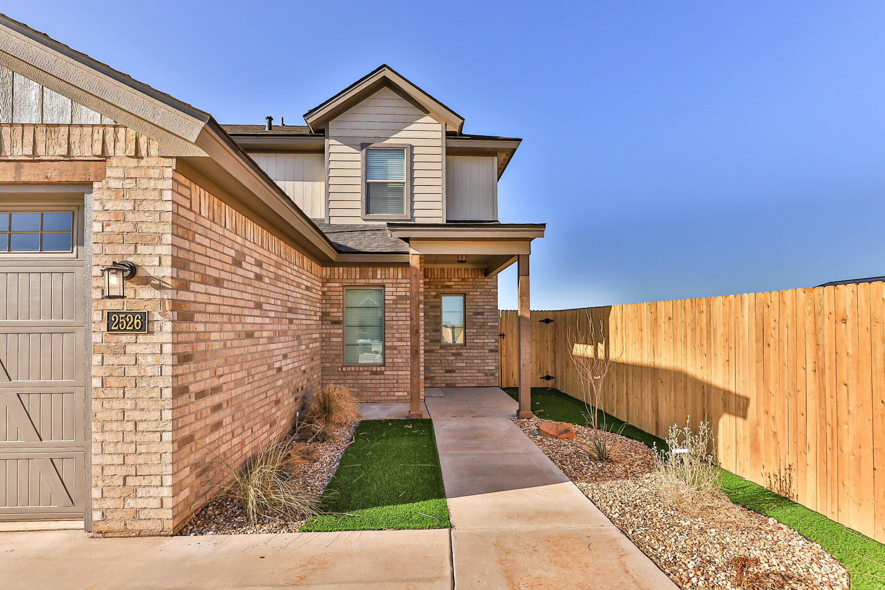 2526 138th Street Lubbock, TX 79423 - Photo 5 of 36 a front view of a house with a yard