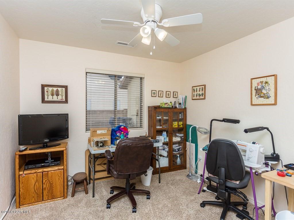 7969 North Sunset Ridge Prescott Valley, AZ 86315 - Photo 14 of 19 a view of a workspace with furniture and a window
