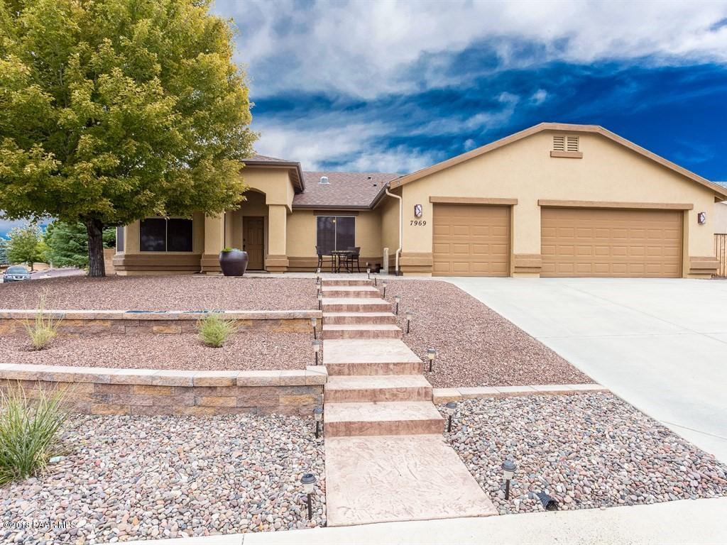 7969 North Sunset Ridge Prescott Valley, AZ 86315 - Photo 2 of 19 a front view of a house with a yard