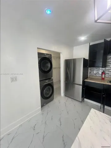 a storage room with washer and dryer
