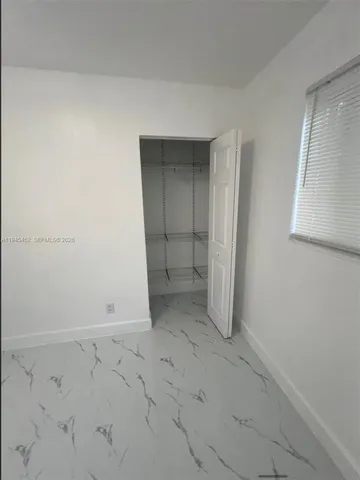 en empty room with windows