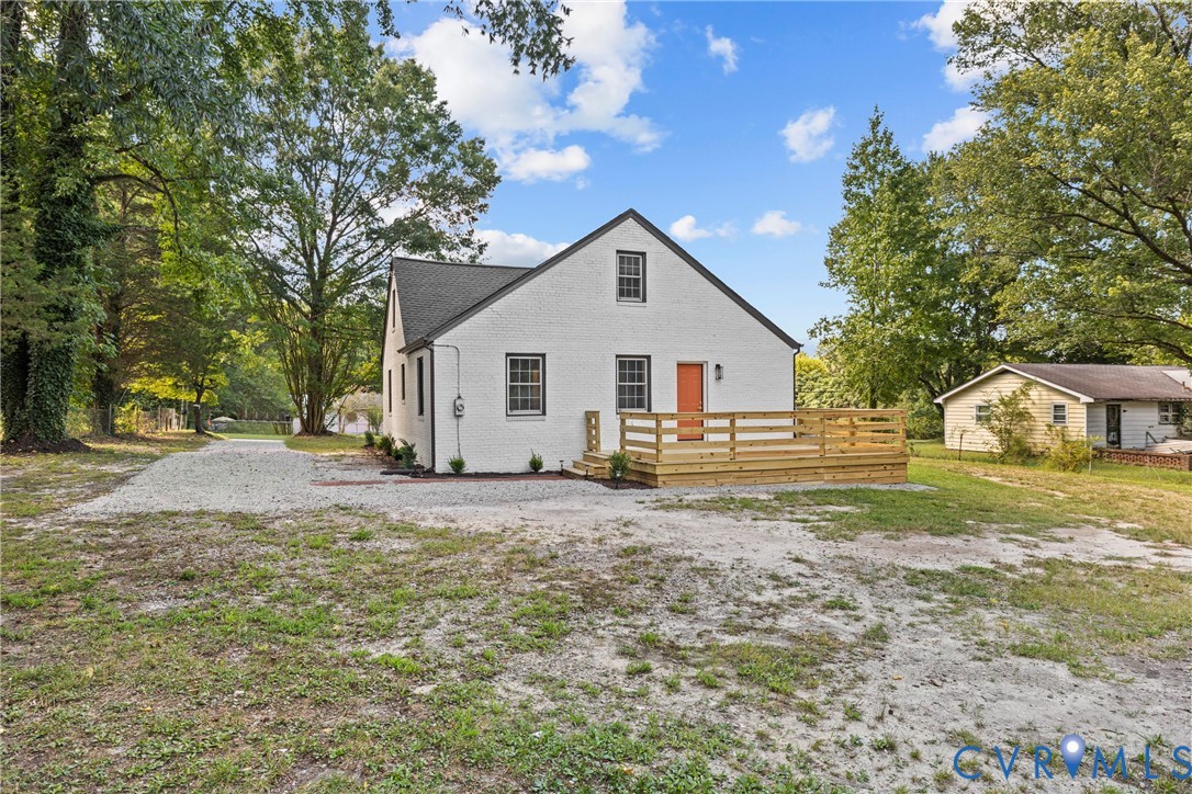 821 Fort Lee Road Petersburg, VA 23803 - Photo 35 of 45 White exterior with dark trim windows, gabled roof