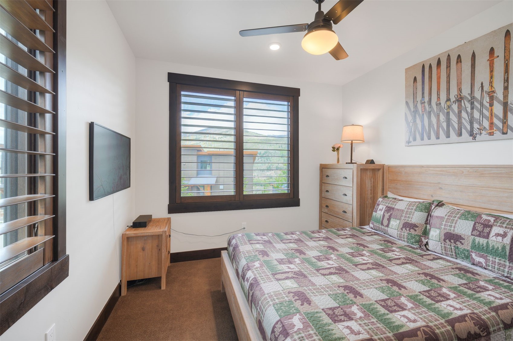 21 Moss Way Silverthorne, CO 80498 - Photo 24 of 50 a bedroom with a bed and a flat screen tv