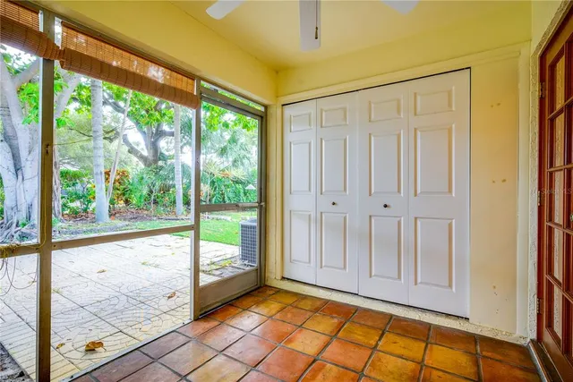 a view of empty room with wooden floor and windows