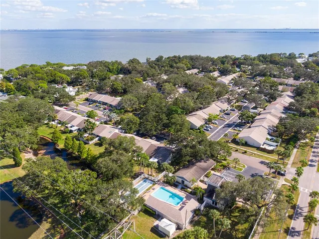 an aerial view of a house with garden space and street view