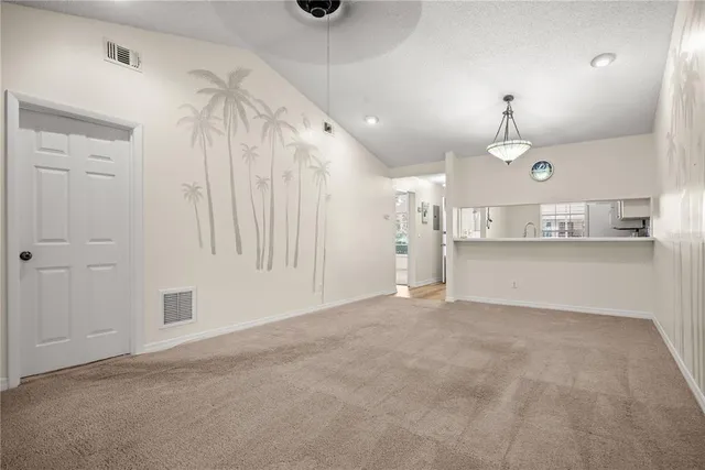 a view of a kitchen with a sink and cabinets