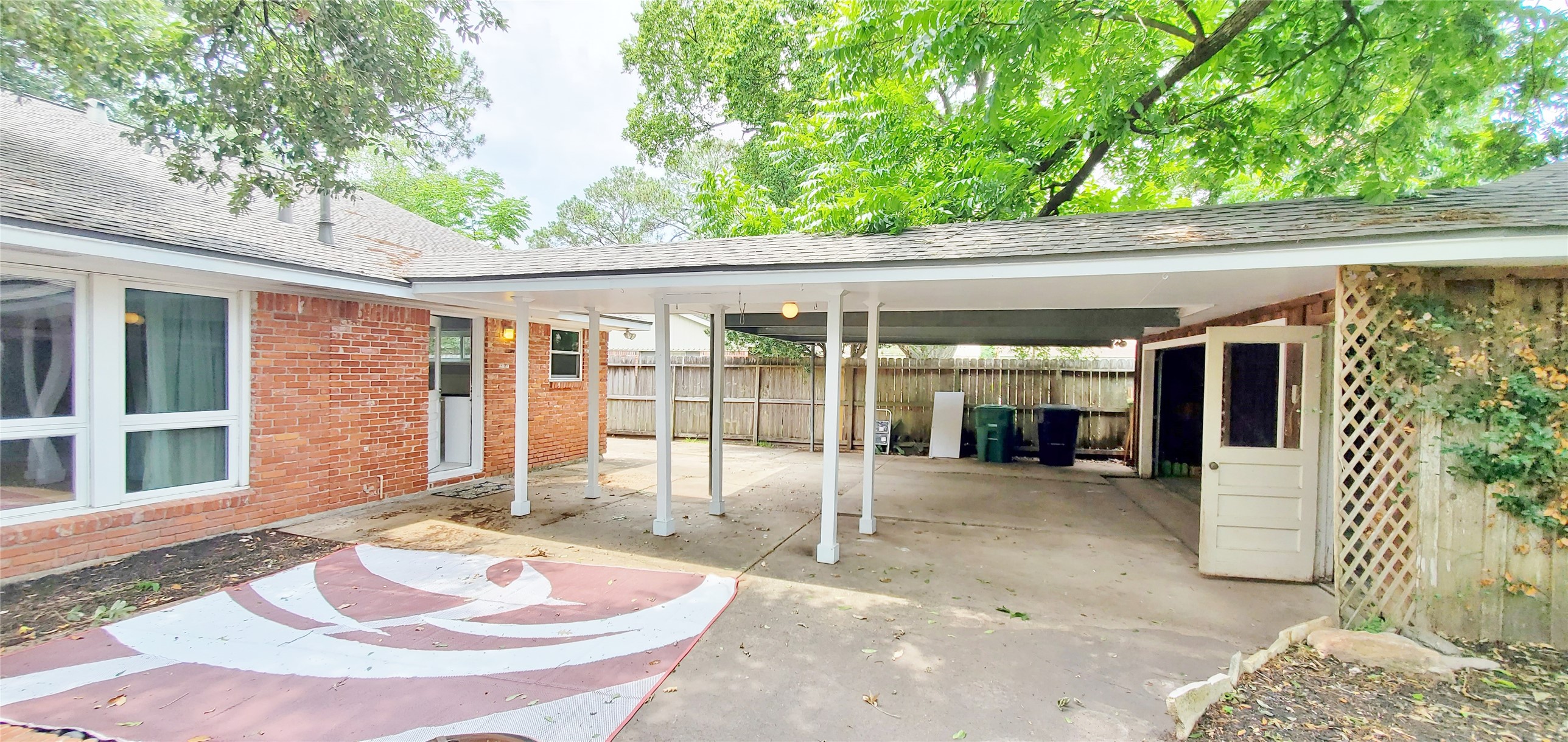 5630 Edith Street Houston, TX 77081 - Photo 27 of 30 Covered carport and 2 car garage connected to the home.