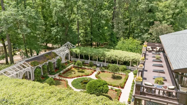 a view of a house with roof deck front of house