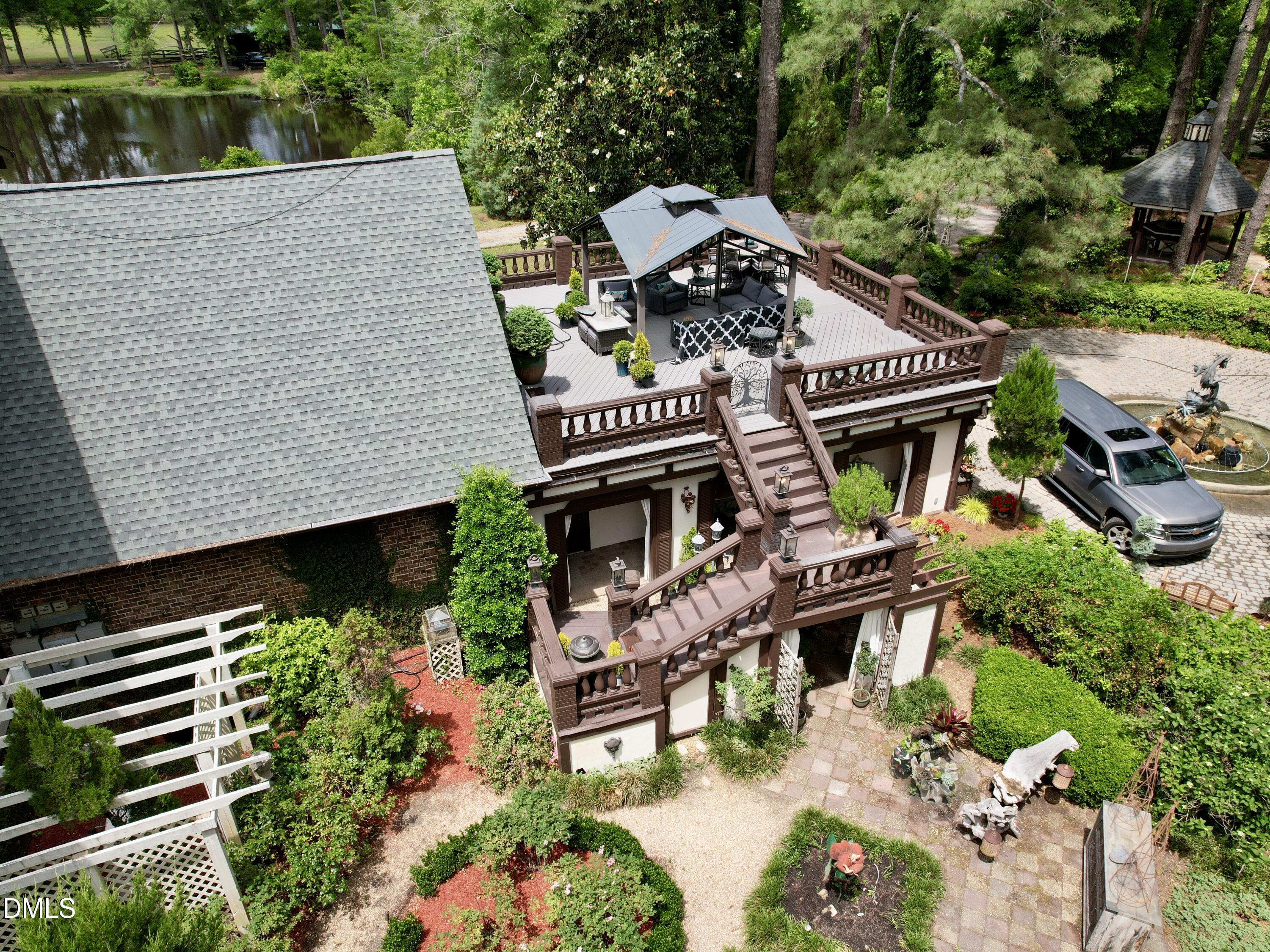 768 Bethesda Church Road Orrum, NC 28369 - Photo 17 of 91 an aerial view of a house with balcony and garden