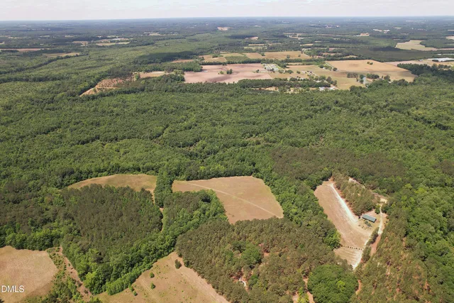 a building outdoor space with patio furniture and potted plants