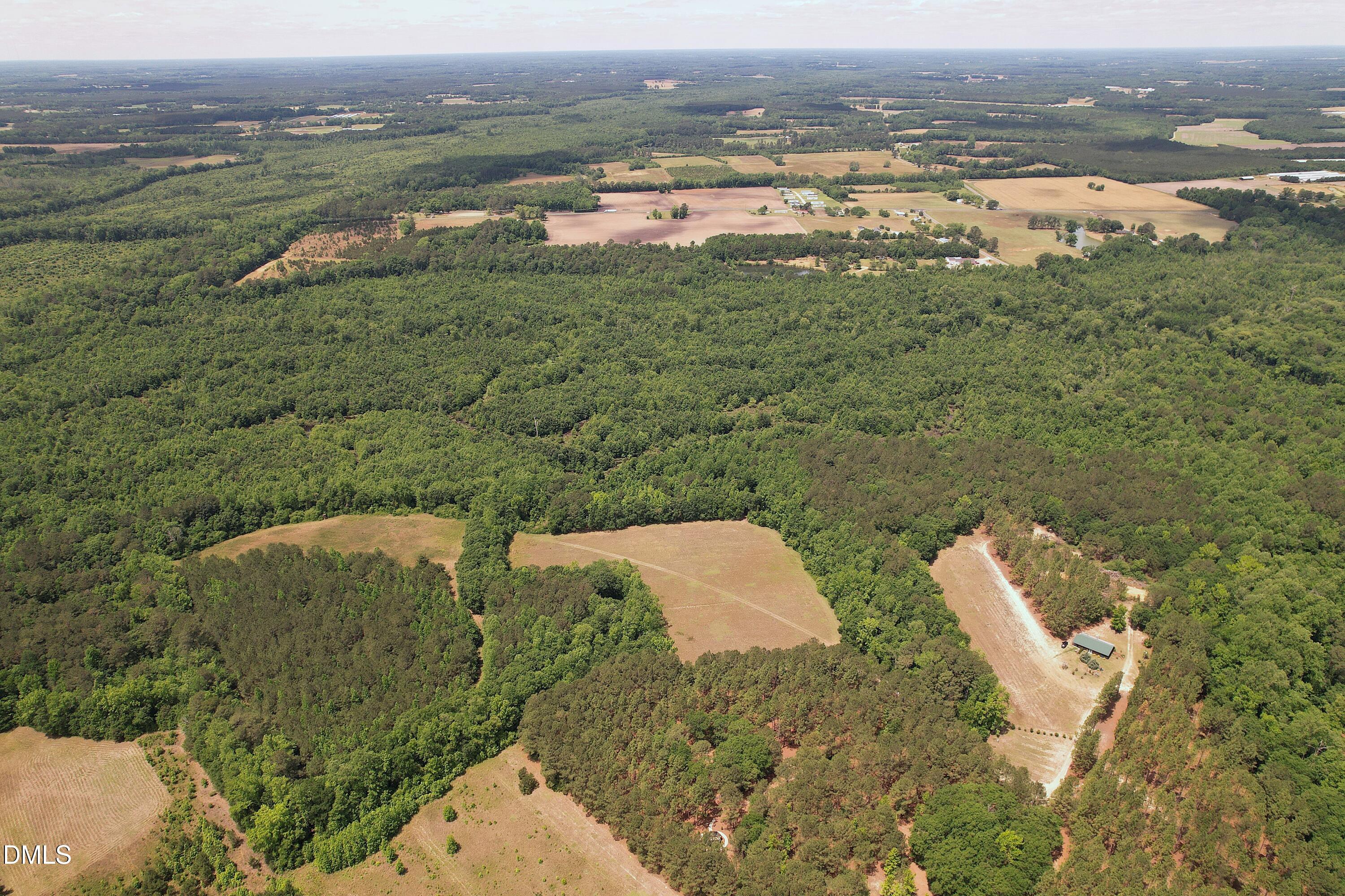768 Bethesda Church Road Orrum, NC 28369 - Photo 26 of 91 an aerial view of a houses with a yard
