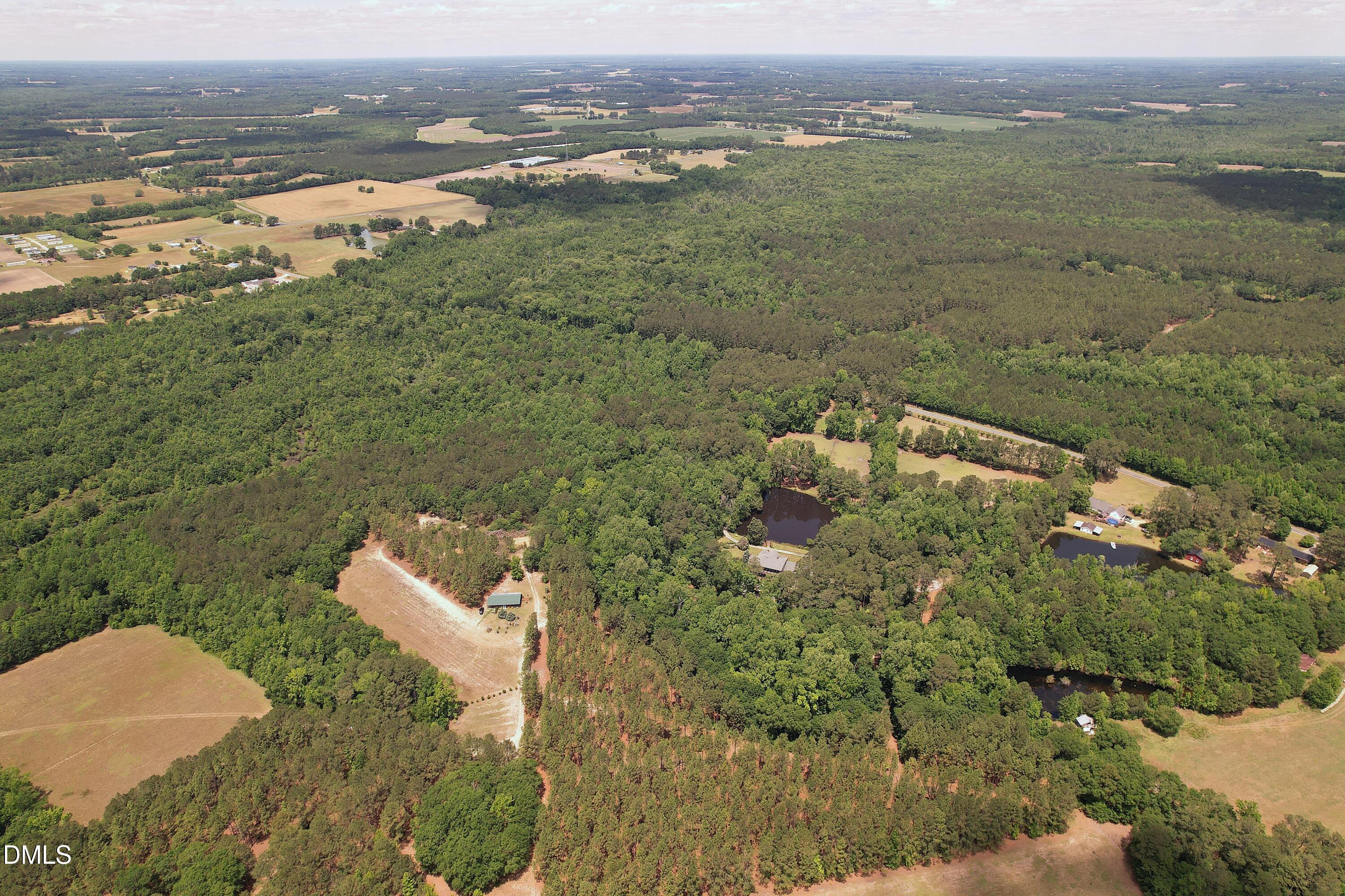 768 Bethesda Church Road Orrum, NC 28369 - Photo 27 of 91 an aerial view of a house with a yard