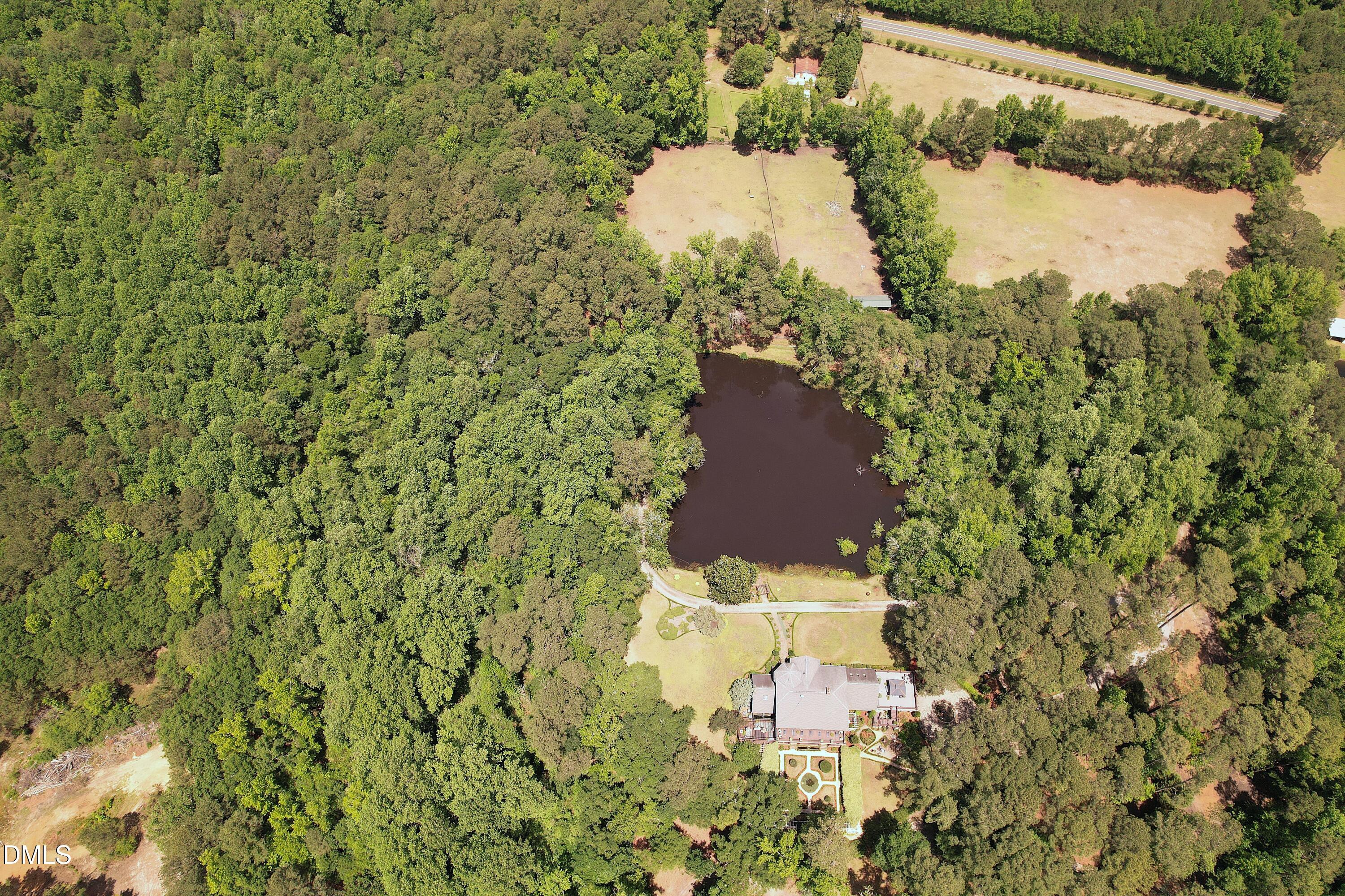 768 Bethesda Church Road Orrum, NC 28369 - Photo 29 of 91 a aerial view of a house with a yard and lake view