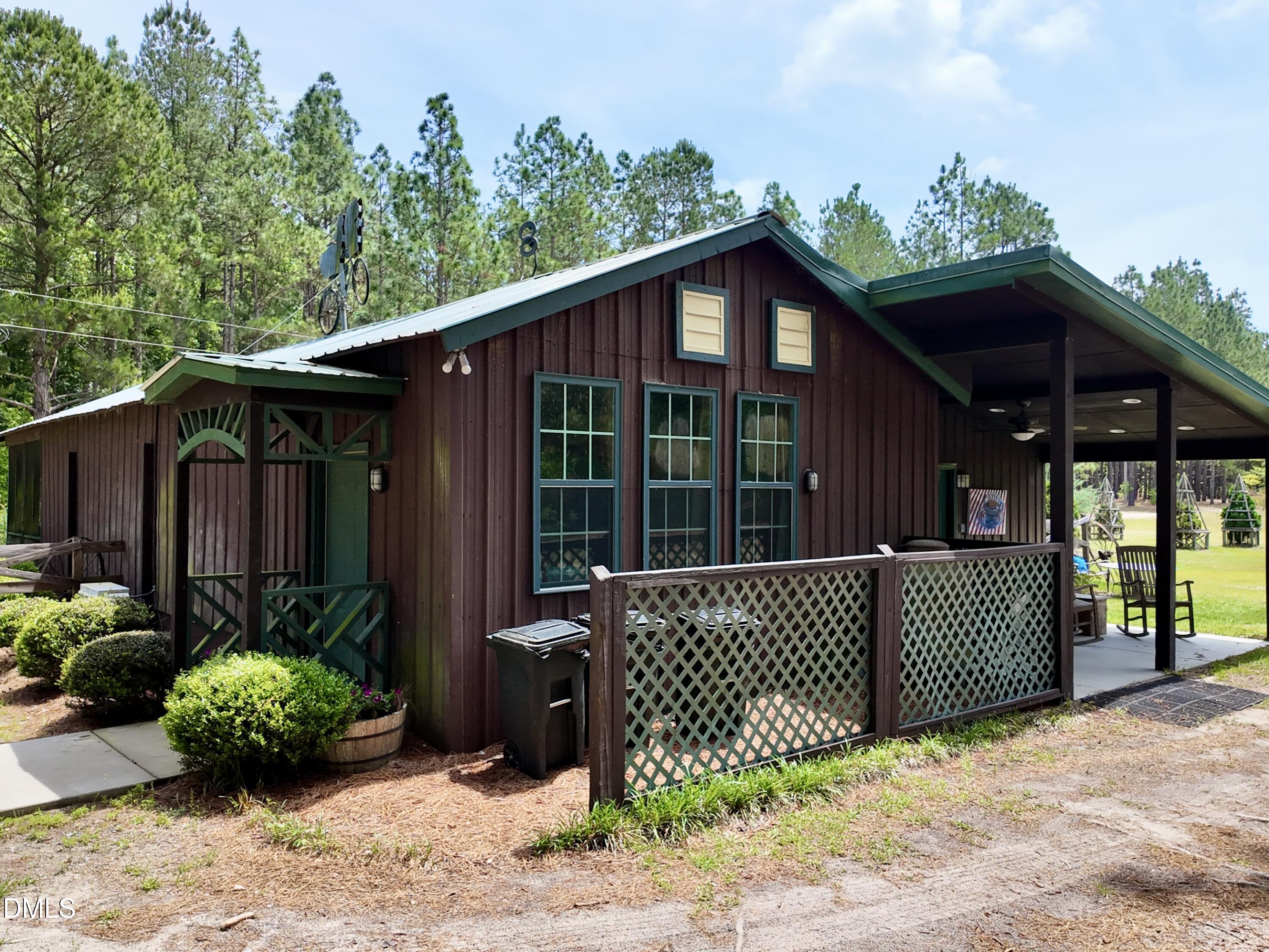 768 Bethesda Church Road Orrum, NC 28369 - Photo 32 of 91 a front view of a house having yard
