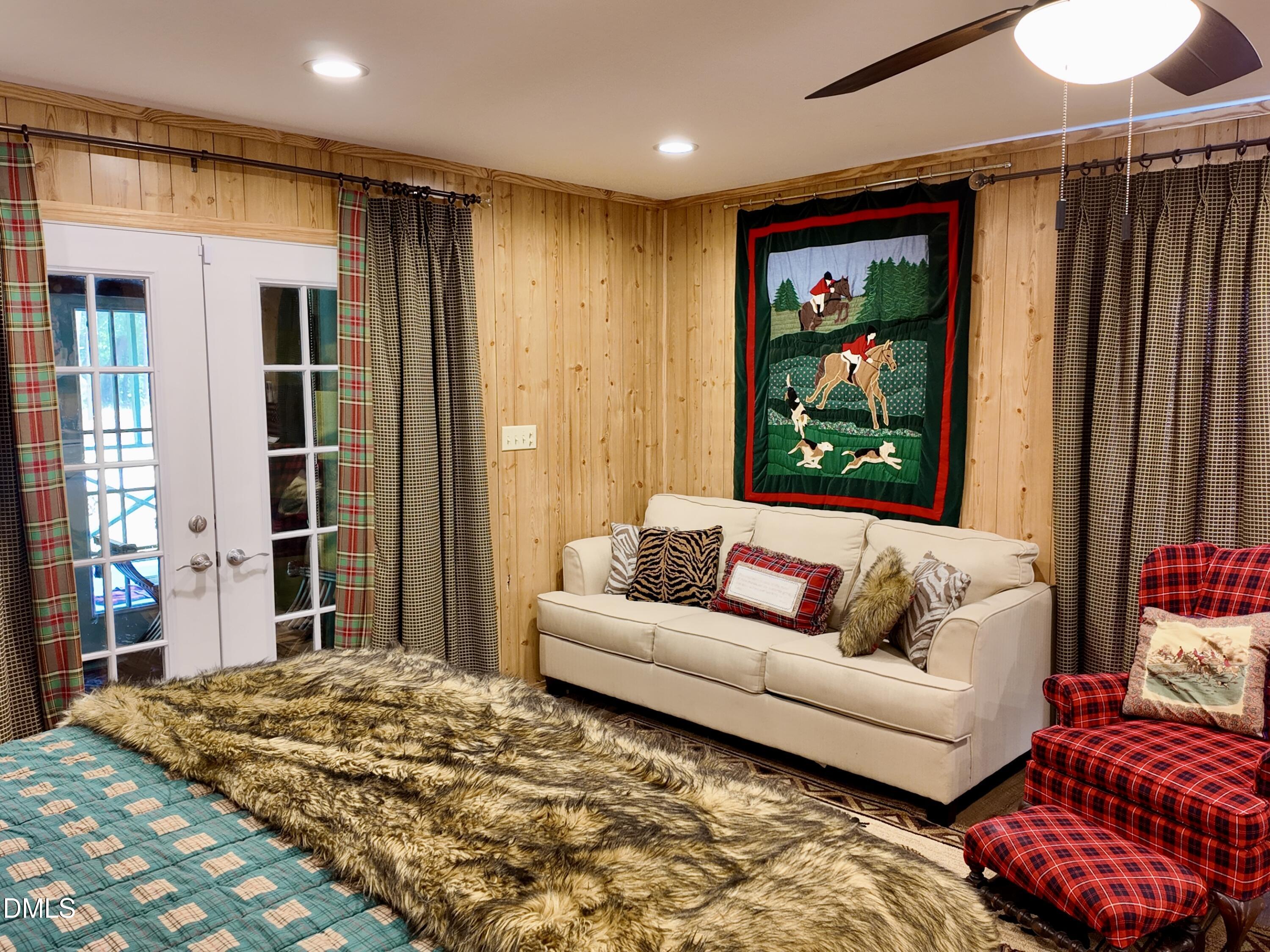 768 Bethesda Church Road Orrum, NC 28369 - Photo 38 of 91 a living room with furniture and a flat screen tv