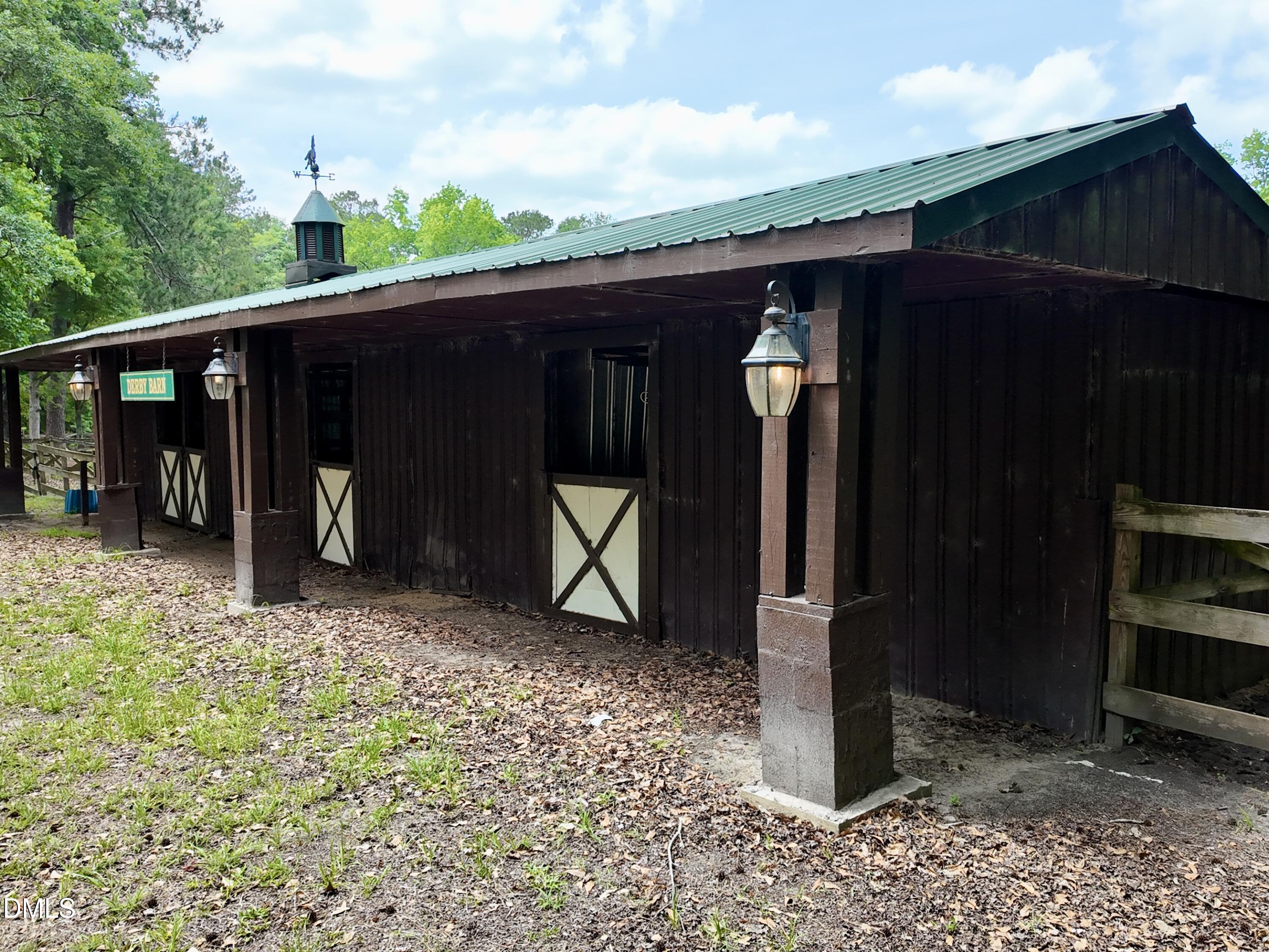 768 Bethesda Church Road Orrum, NC 28369 - Photo 53 of 91 a view of a wooden door and a yard