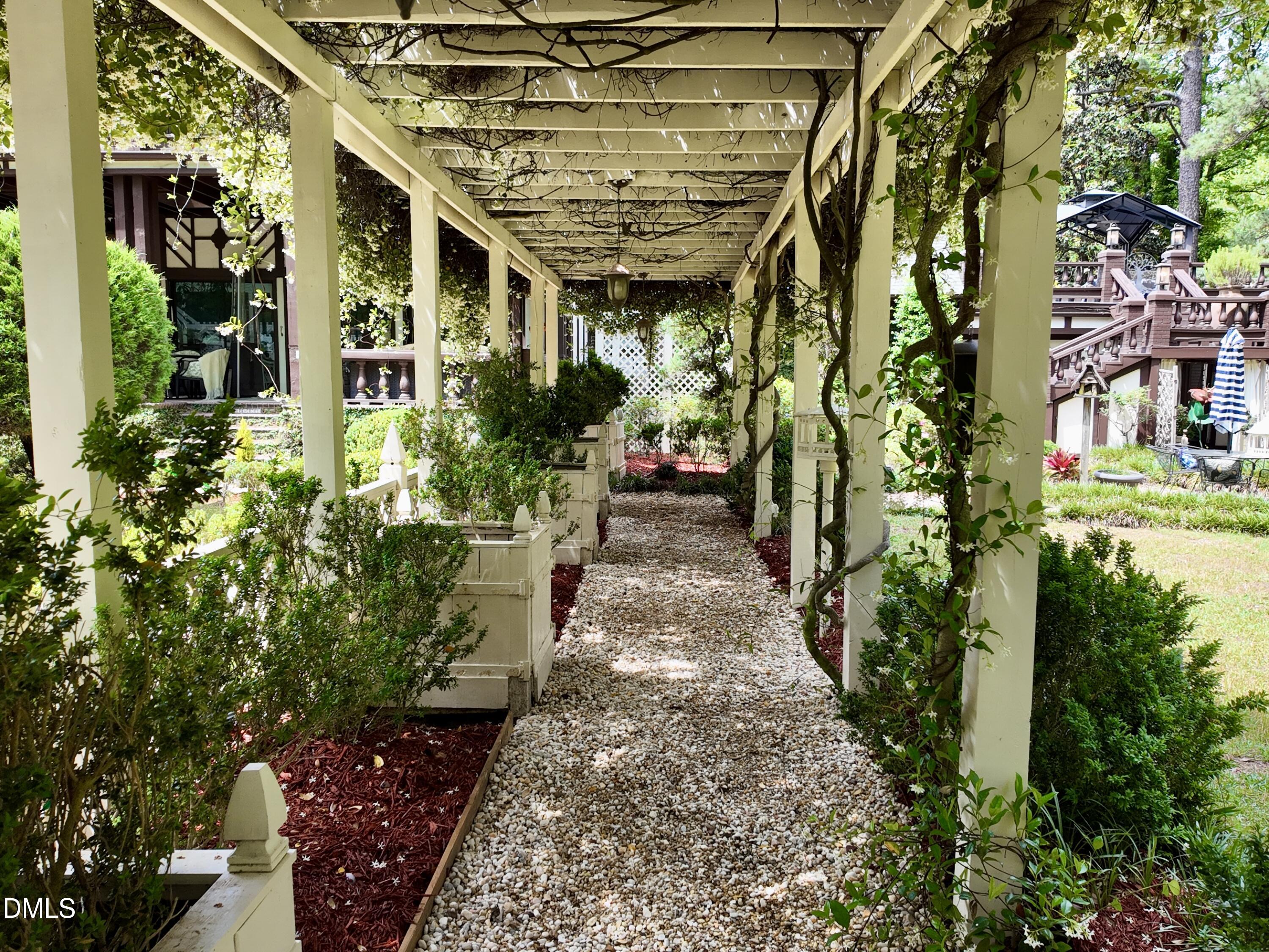 768 Bethesda Church Road Orrum, NC 28369 - Photo 60 of 91 a view of a pathway with flower plants