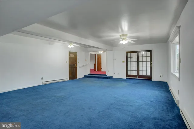 a bathroom with a granite countertop bathtub shower sink and toilet