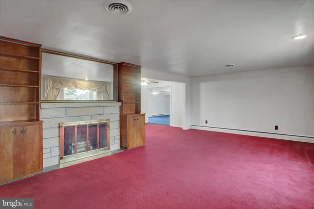 a view of empty room with large windows