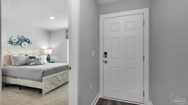 a bedroom with a bed and a couch