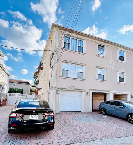 a car parked in front of a house