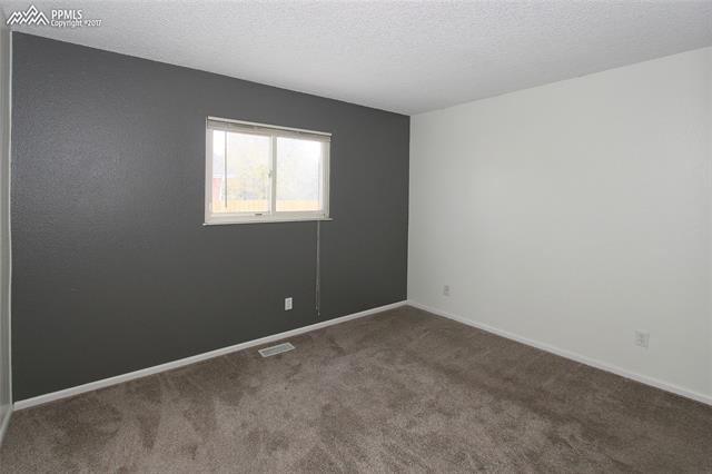 1835 Monterey Road Colorado Springs, CO 80910 - Photo 14 of 22 Second bedroom