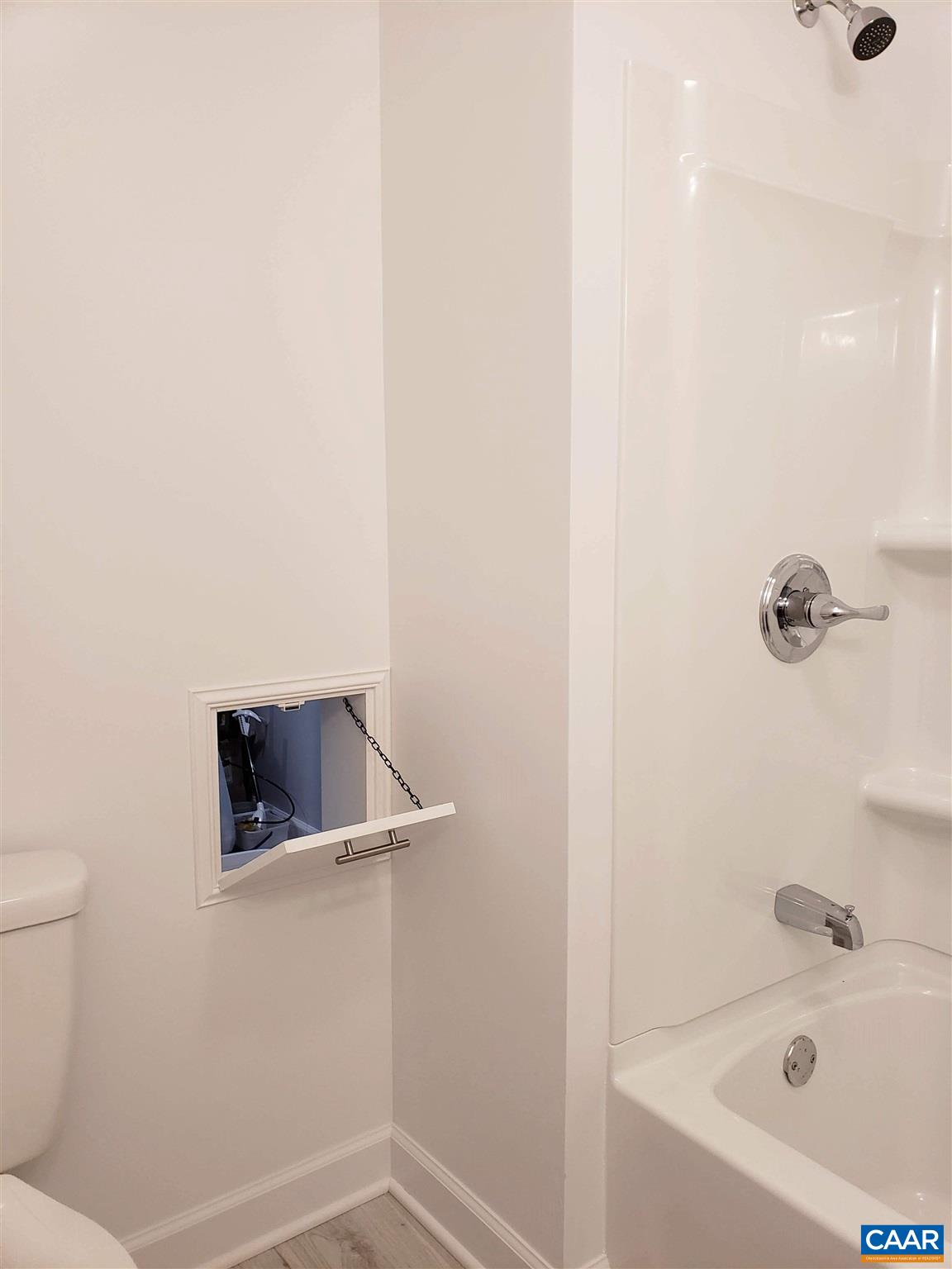699 Black Cat Road Keswick, VA 22947 - Photo 19 of 33 a bathroom with a bathtub and shower