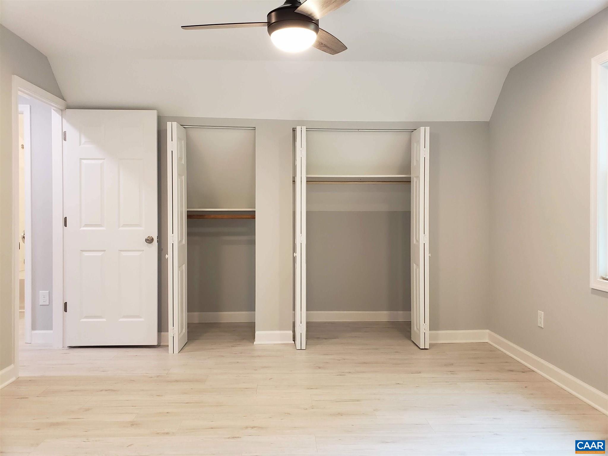 699 Black Cat Road Keswick, VA 22947 - Photo 23 of 33 wooden floor in an empty room with a bathroom