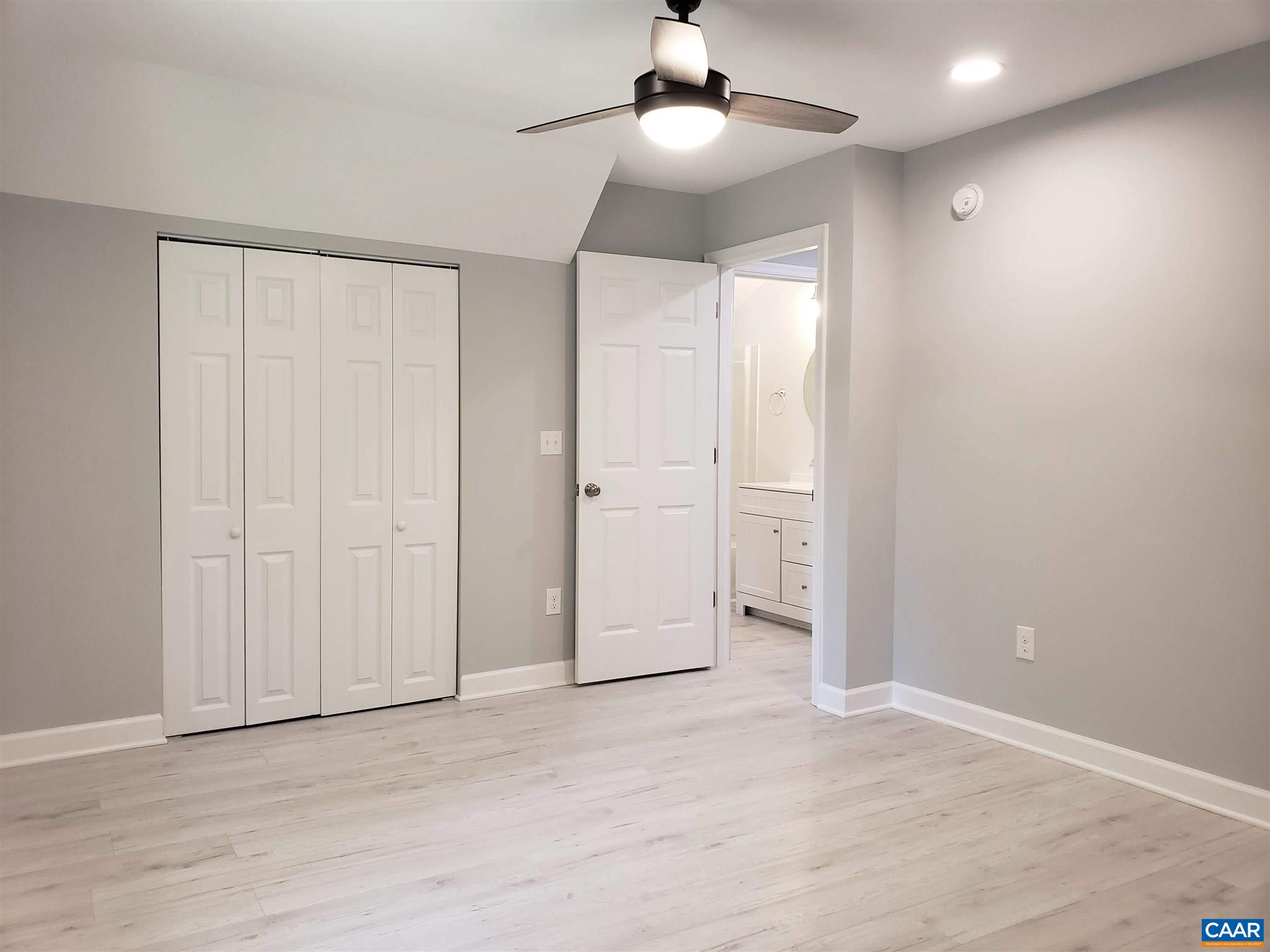 699 Black Cat Road Keswick, VA 22947 - Photo 25 of 33 wooden floor in an empty room with a window