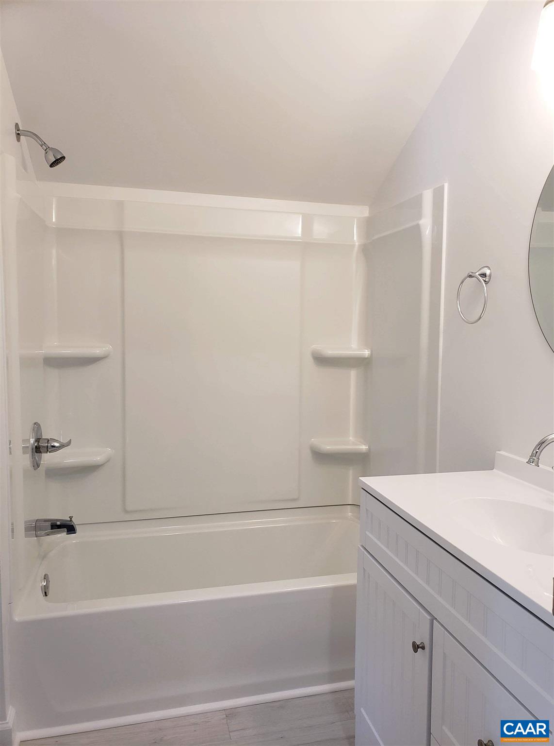 699 Black Cat Road Keswick, VA 22947 - Photo 27 of 33 a bathroom with a bathtub and a shower