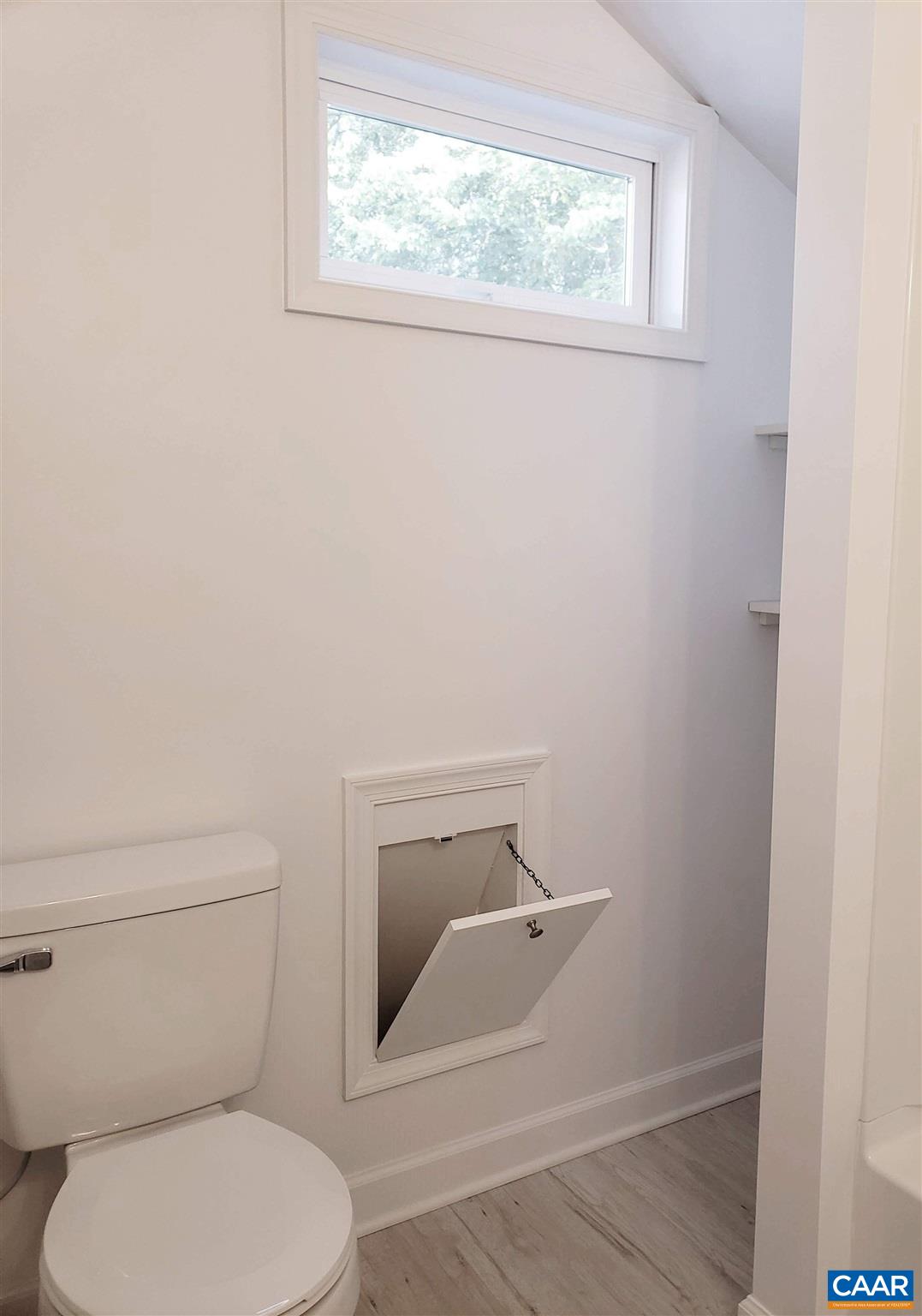 699 Black Cat Road Keswick, VA 22947 - Photo 29 of 33 a bathroom with a toilet