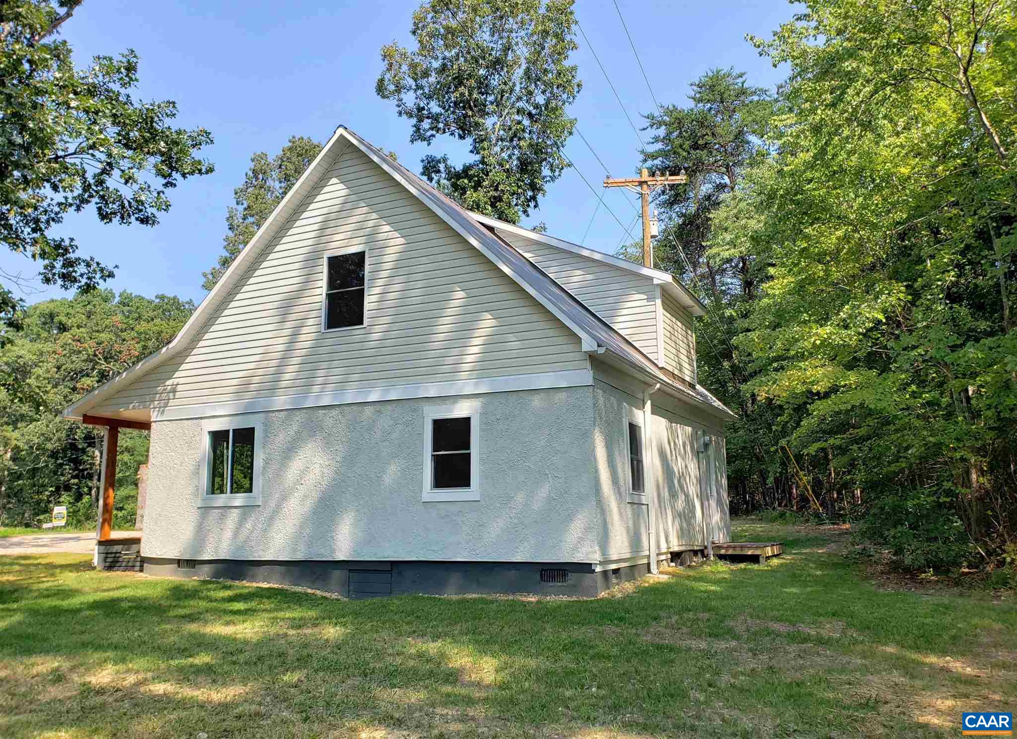 699 Black Cat Road Keswick, VA 22947 - Photo 32 of 33 a view of a house with a yard