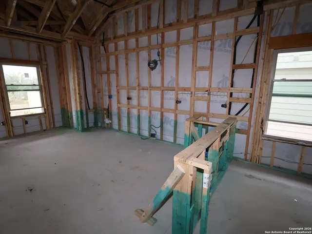 a view of a hallway with windows