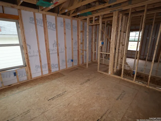 a view of a room with wooden walls