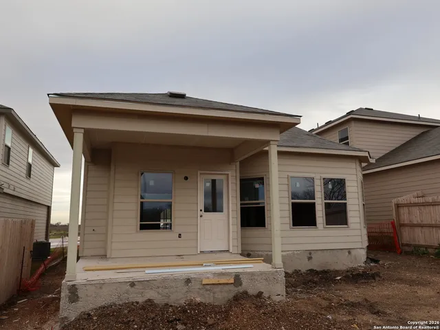 a front view of a house with yard