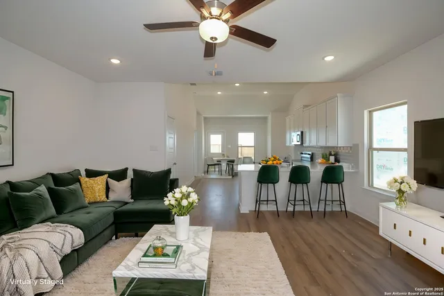 a bedroom with a large bed and a large window