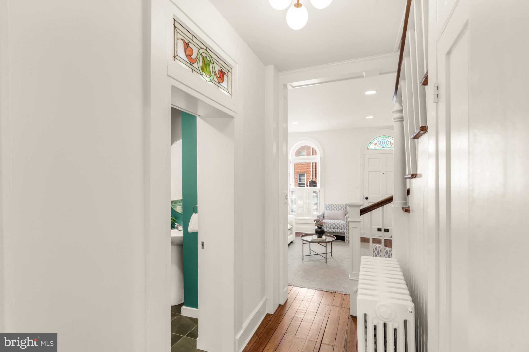 1213 Battery Avenue Baltimore, MD 21230 - Photo 11 of 39 a view of a hallway with furniture and wooden floor