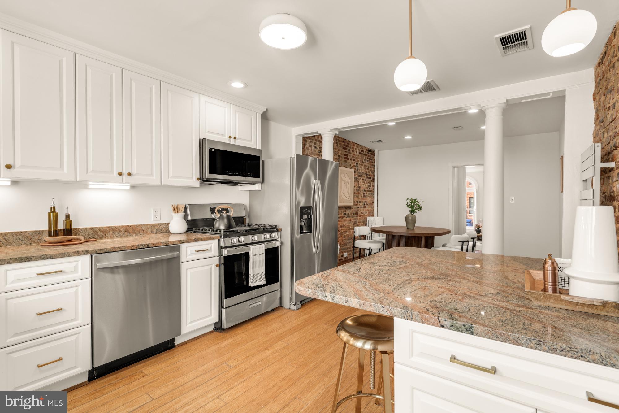 1213 Battery Avenue Baltimore, MD 21230 - Photo 14 of 39 a kitchen with a stove and a sink