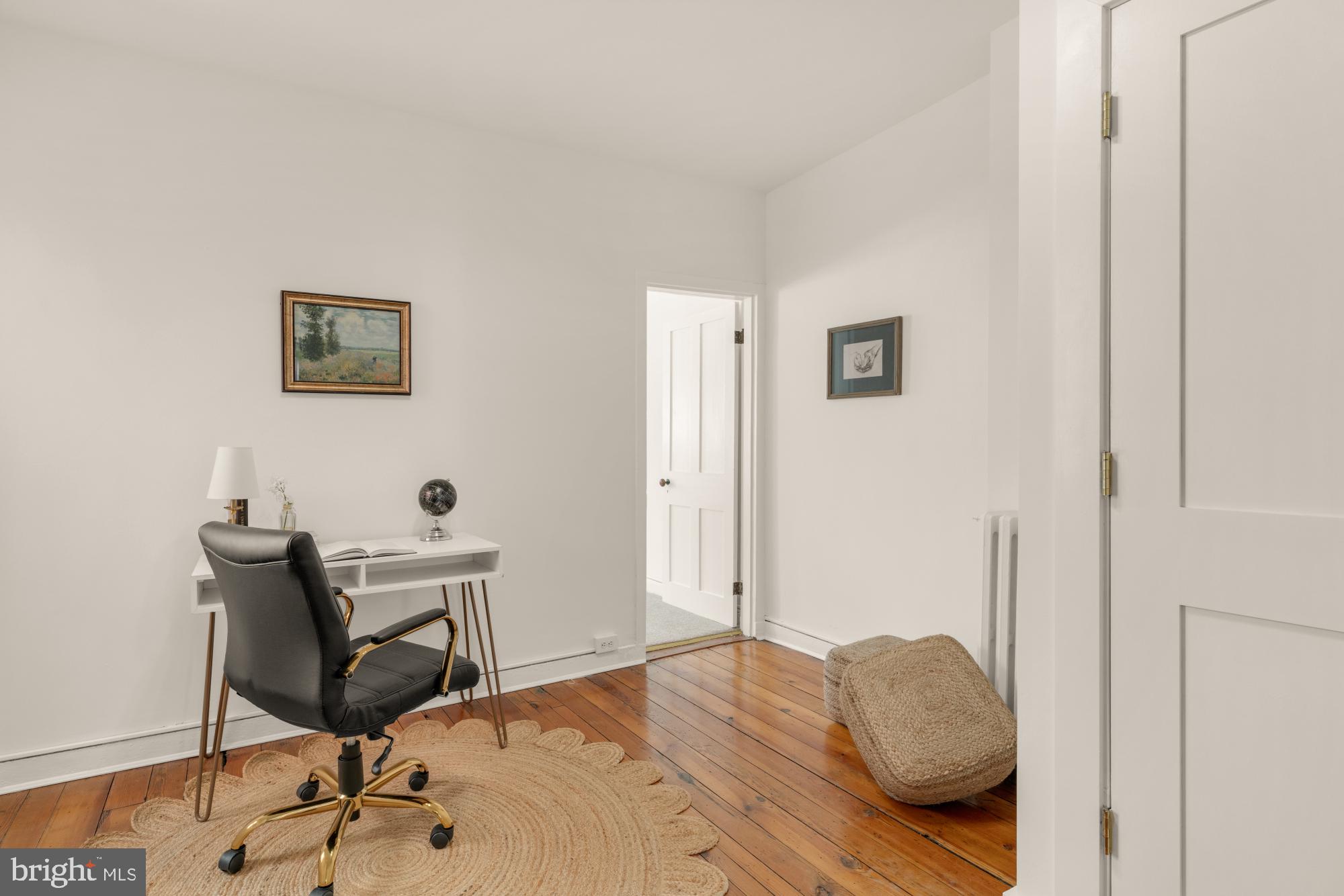 1213 Battery Avenue Baltimore, MD 21230 - Photo 20 of 39 a bedroom with a bed and chair