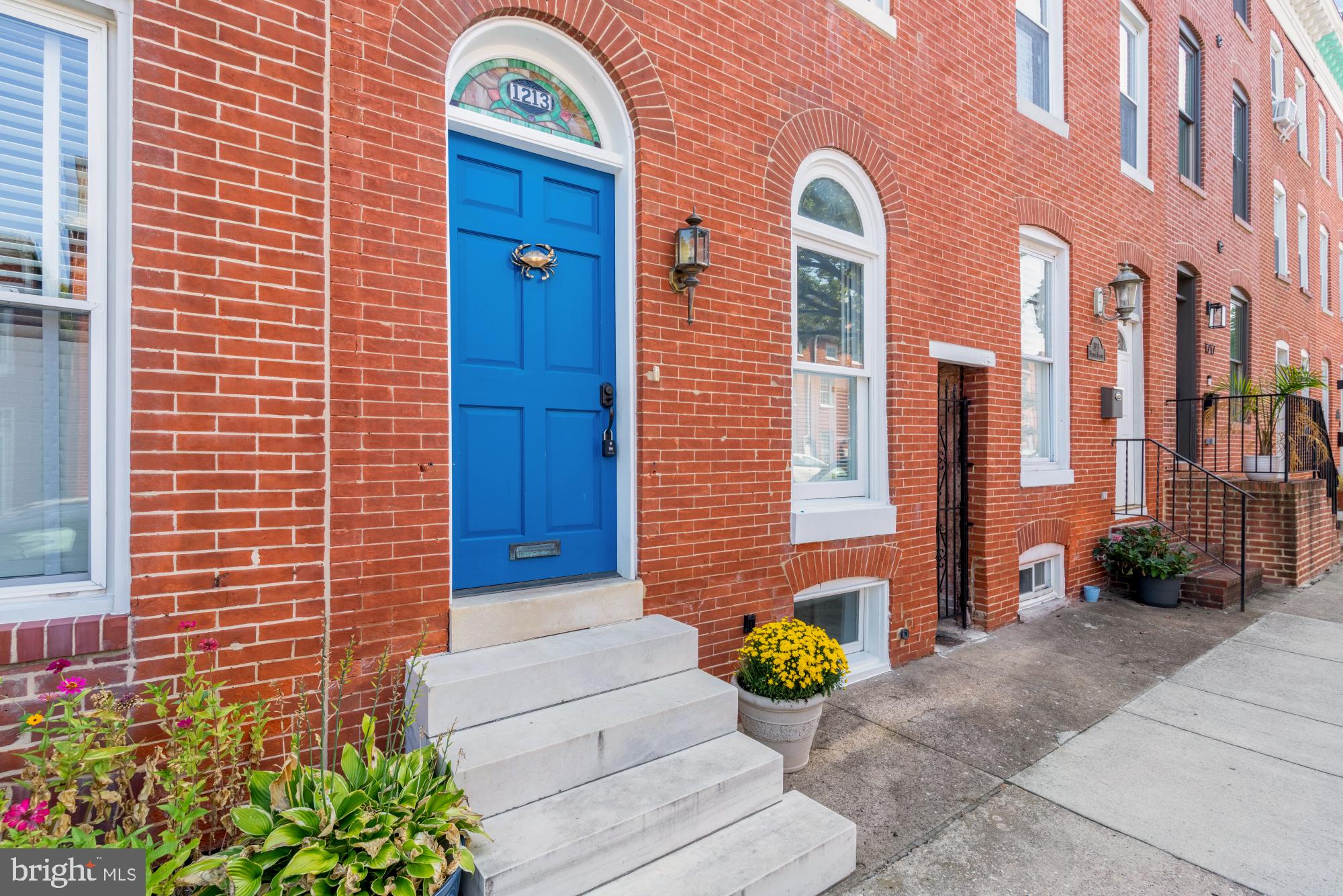 1213 Battery Avenue Baltimore, MD 21230 - Photo 2 of 39 a view of a brick building with potted plants