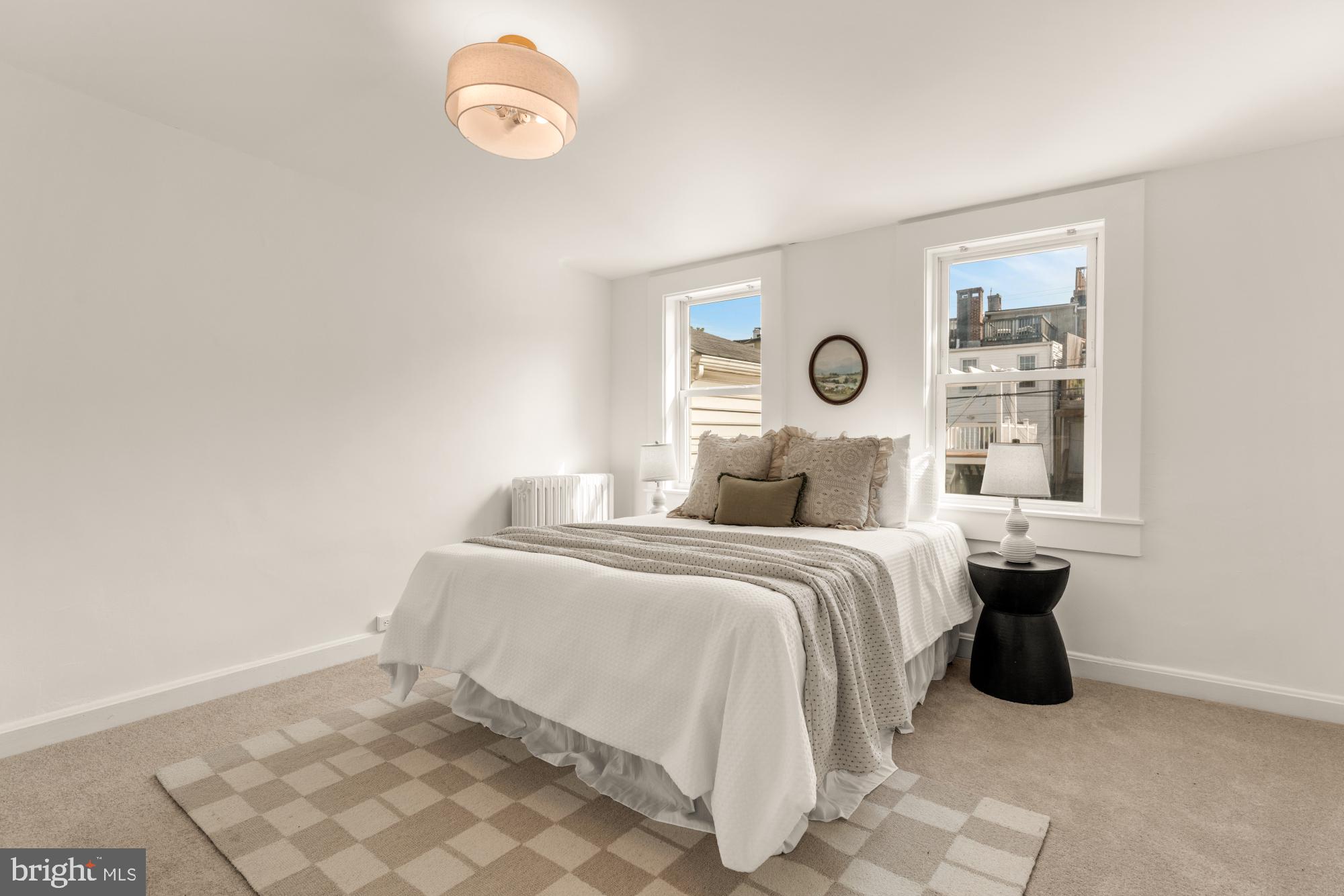 1213 Battery Avenue Baltimore, MD 21230 - Photo 21 of 39 a bedroom with a bed and a window