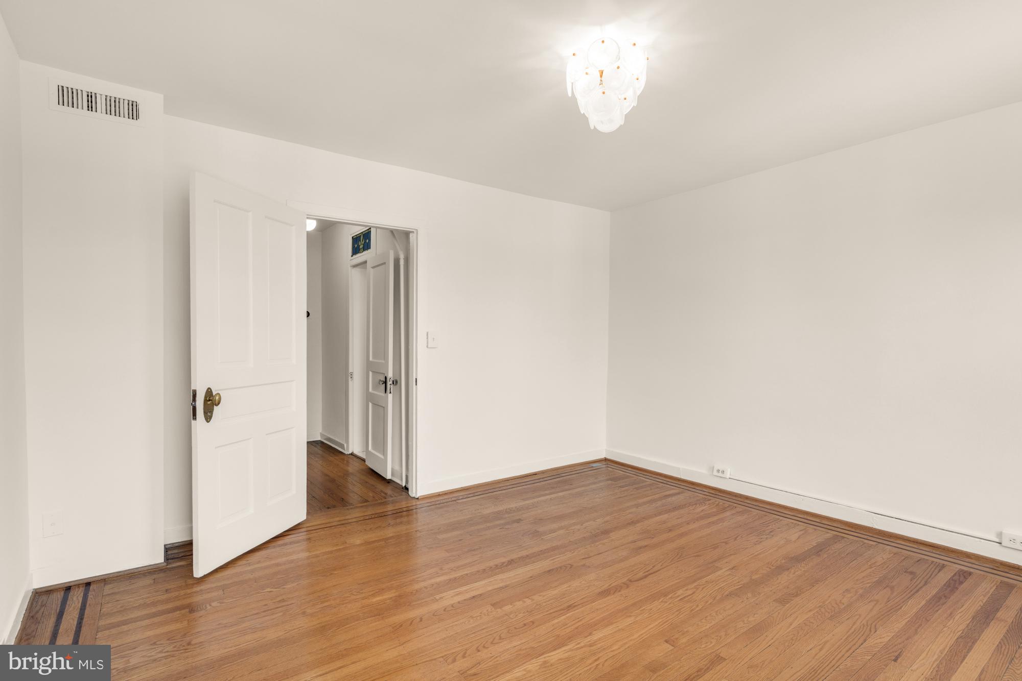 1213 Battery Avenue Baltimore, MD 21230 - Photo 27 of 39 a view of empty room with wooden floor