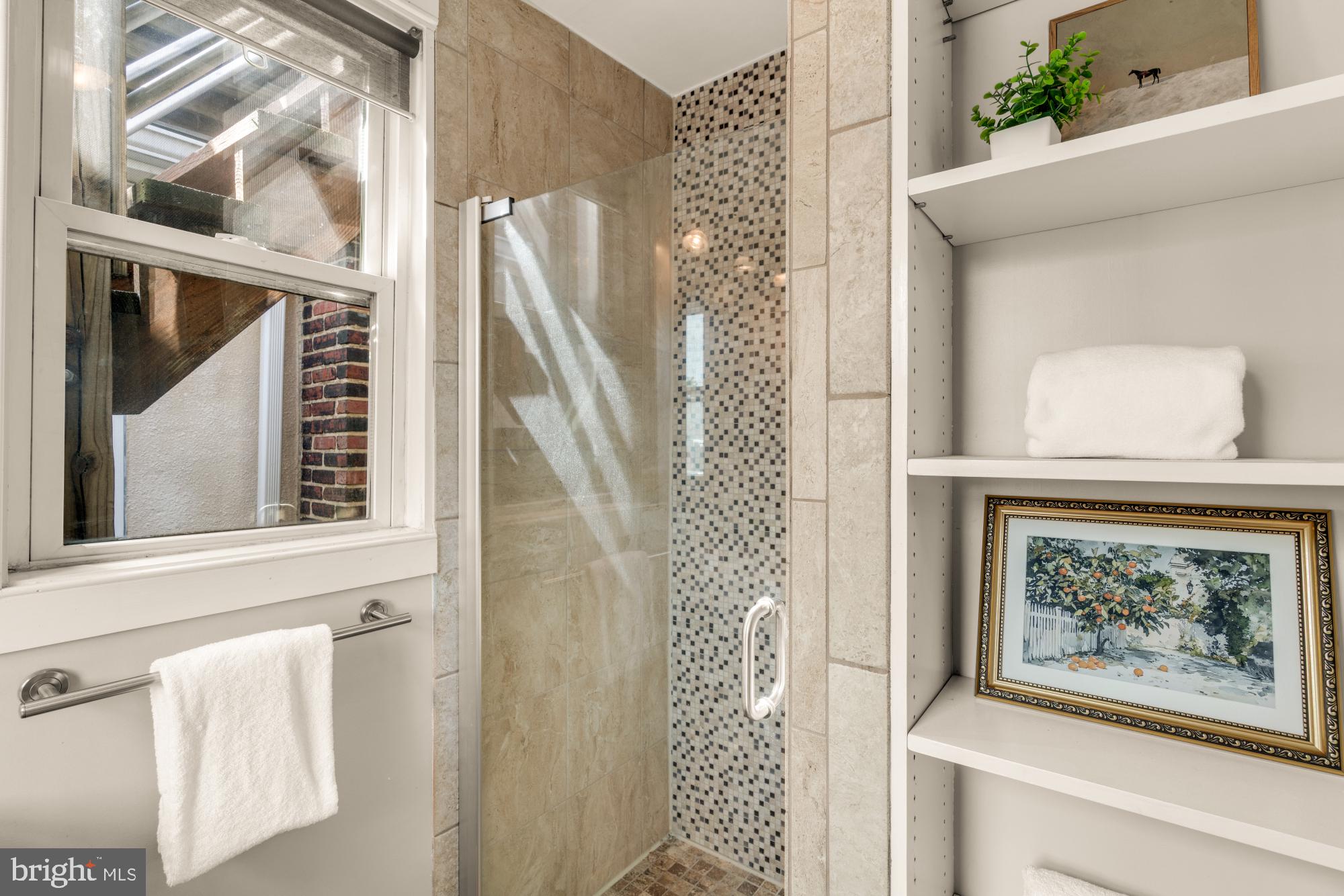 1213 Battery Avenue Baltimore, MD 21230 - Photo 33 of 39 a view of a hallway with paintings on the wall