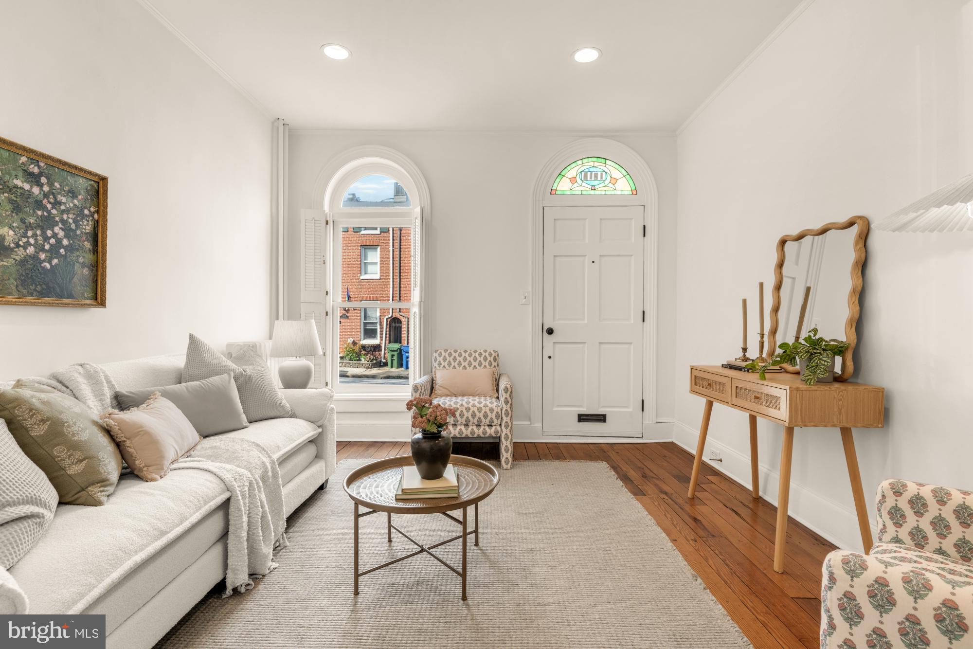 1213 Battery Avenue Baltimore, MD 21230 - Photo 5 of 39 a living room with furniture a rug and a chandelier